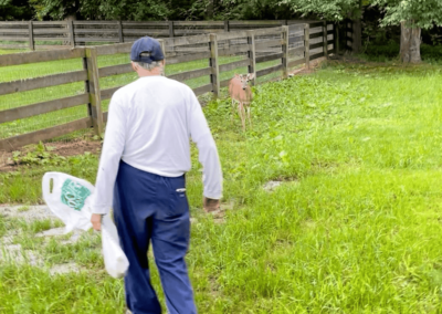 Andrew feeding Deer - Joyous Acres